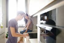 Adult asian couple on kitchen together at home — Stock Photo