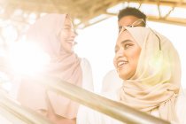 Young muslim group smiling on MRT staircase — Stock Photo