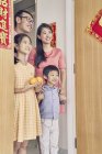 Happy asian family coming to grandparents  at chinese new year — Stock Photo