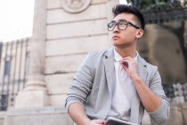 Portrait of a pensive chinese businessman looking away, Spain — Stock Photo