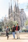 Happy Indian tourists visiting Sagrada Familia in Barcelona Spain — Stock Photo
