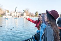 Philipinne friends group enjoining the landscape and lake in Retiro Park Madrid, Spain — Stock Photo