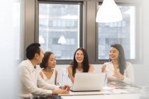 Young asian coworkers working in modern office — Stock Photo