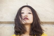 Portrait of chinese woman with messy hair — Stock Photo