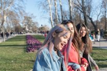 Friends walking around Retiro Park Madrid, Spain — стокове фото