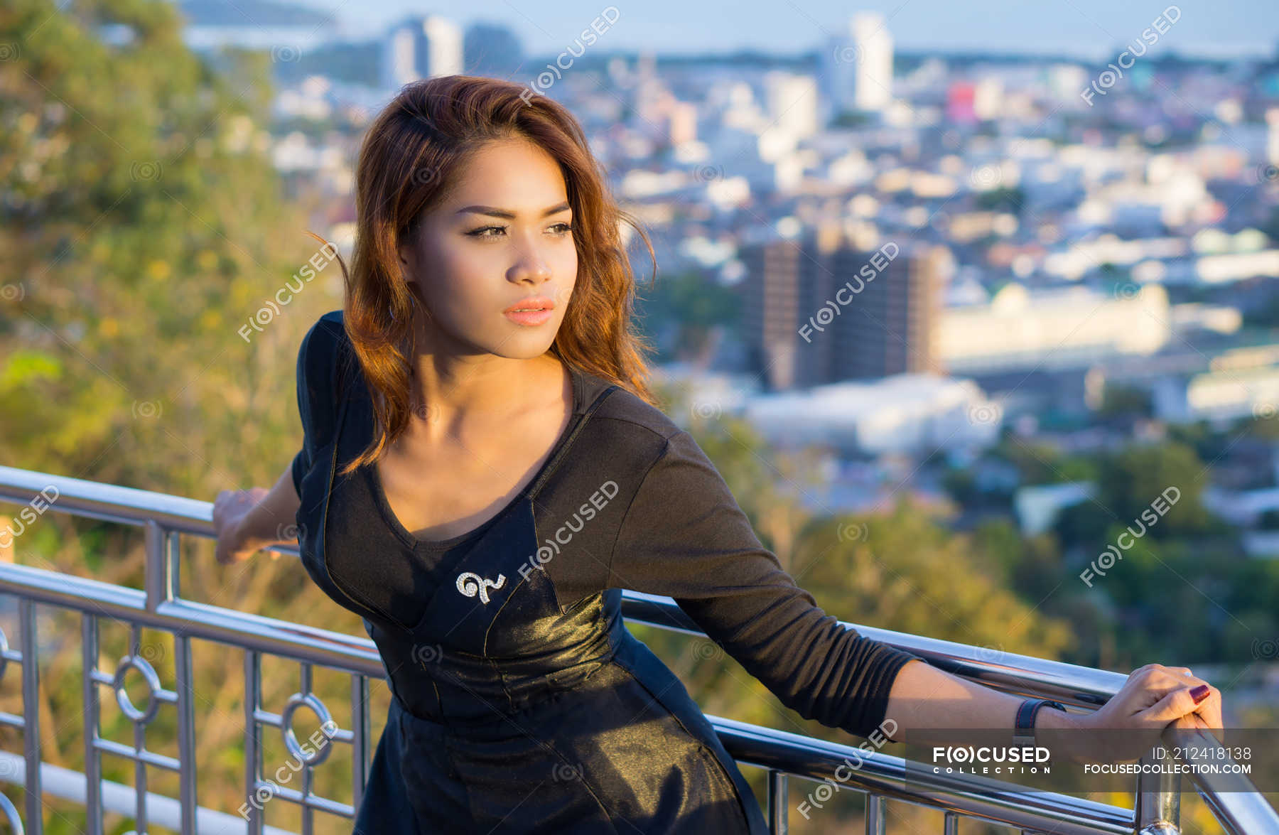 Portrait Of Beautiful Asian Woman Posing To Camera At Phuket City Thailand Looking Away
