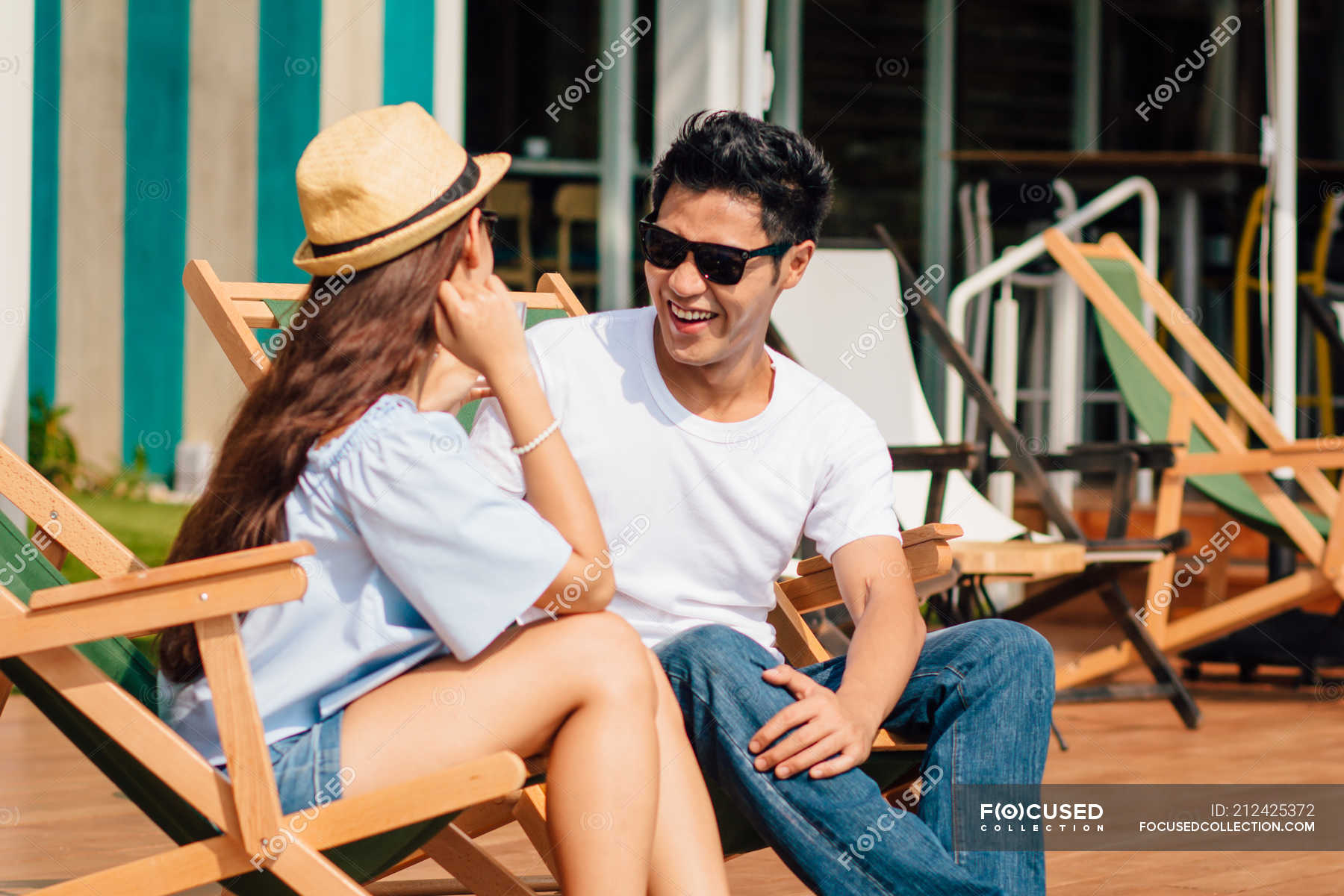 Attractive Young Asian Couple Relaxing Near Pool — Indoors, Copy Space 