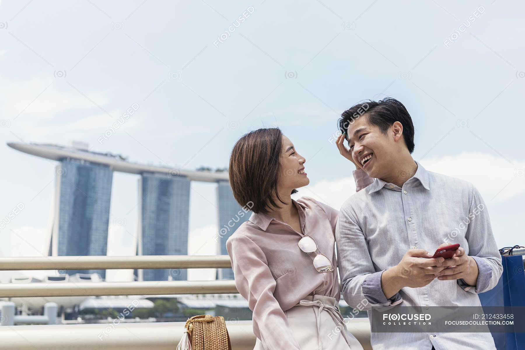 Young asian couple spending time together in Singapore — closeness ...