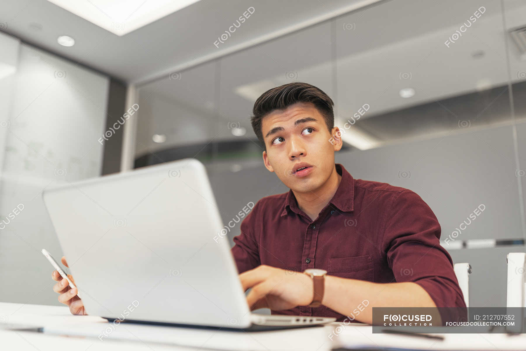 Young Asian Business Man Using Laptop In Modern Office — Entrepreneur ...