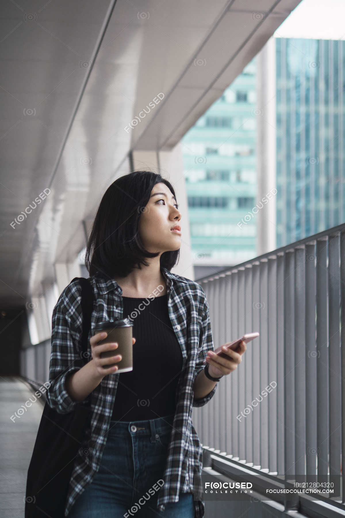 Young beautiful asian girl in casual clothes using smartphone on city  streets — coffee, digital - Stock Photo | #212804320