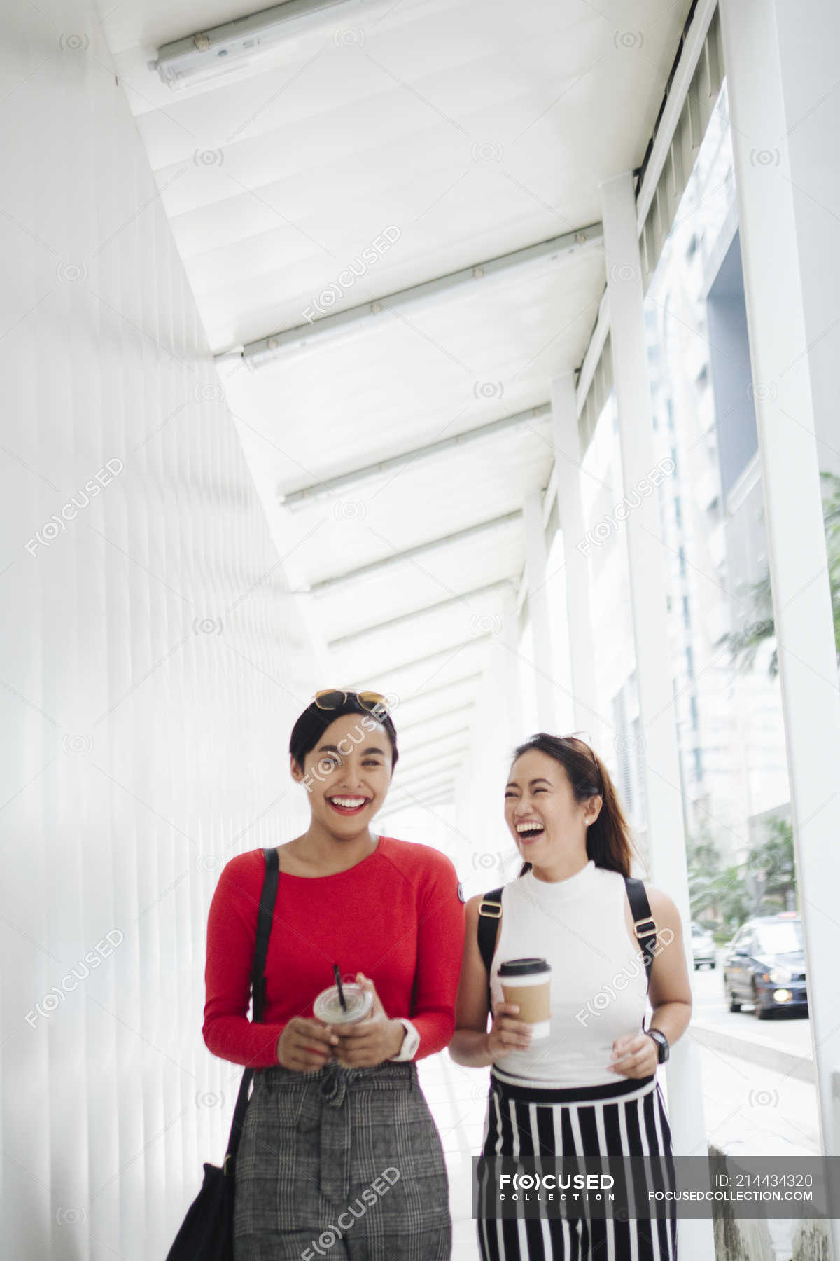 Young asian female friends together walking with coffee — juice, trendy ...