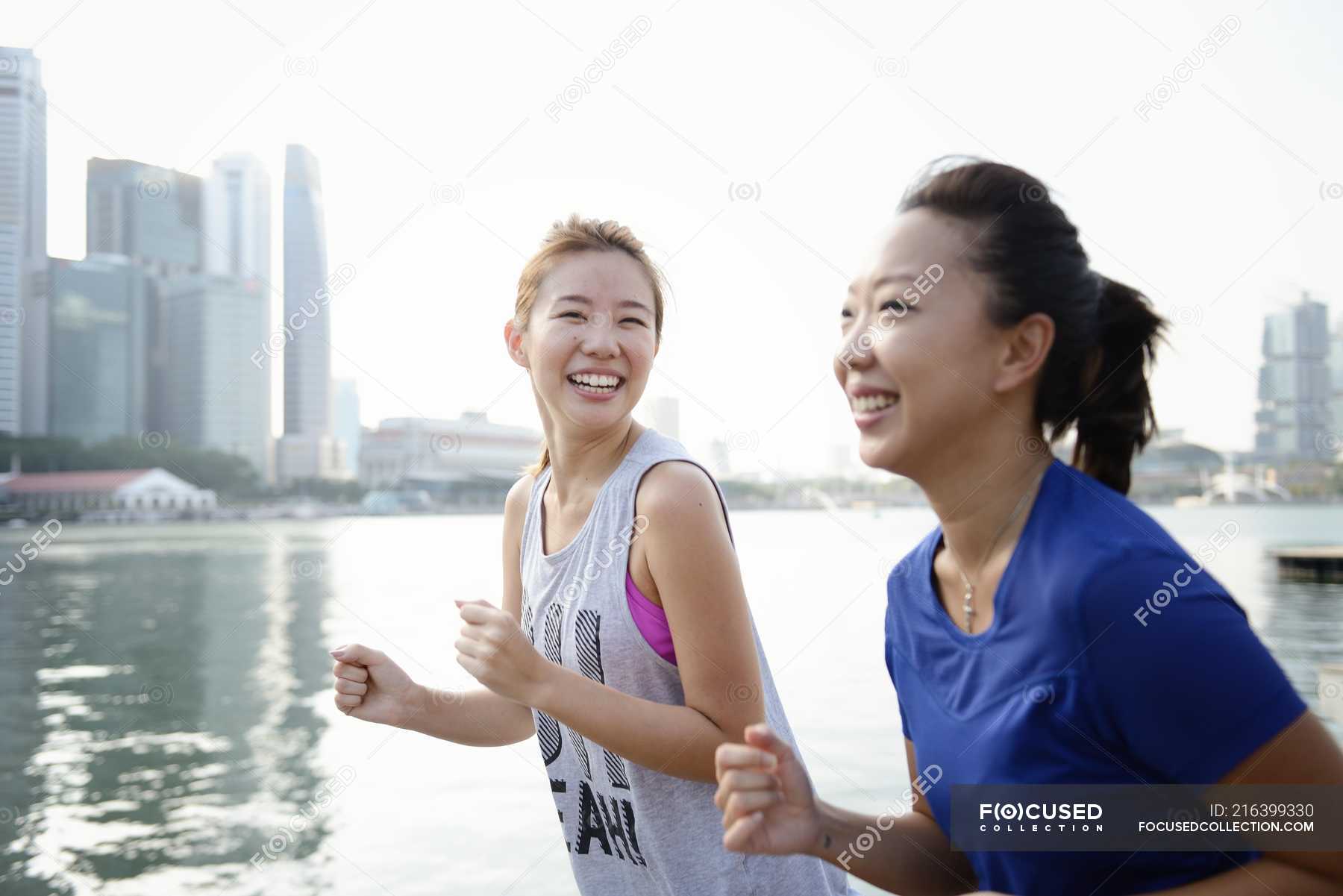 Young asian women running outdoors — office, preparation - Stock Photo ...