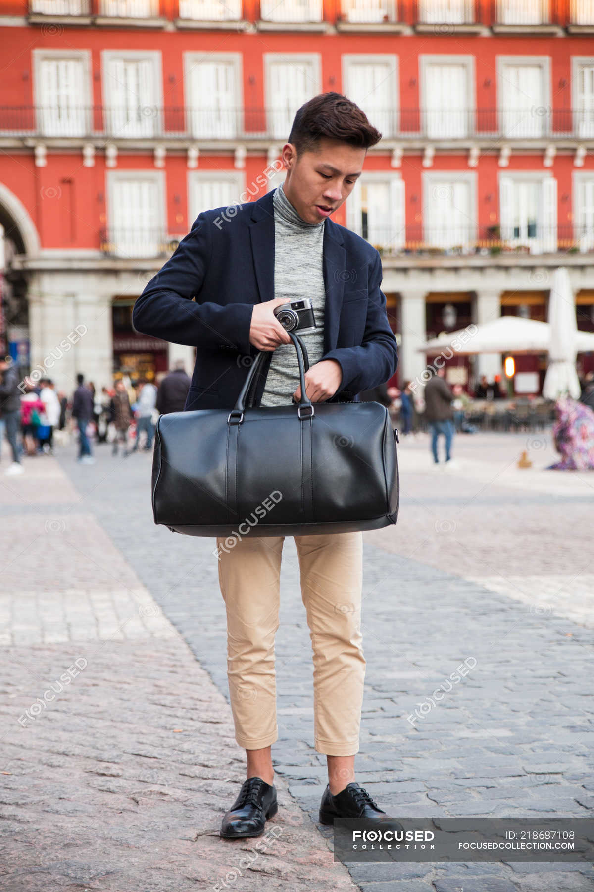 Casual Young Chinese Man At Plaza Mayor In Madrid Spain Business Modern Stock Photo