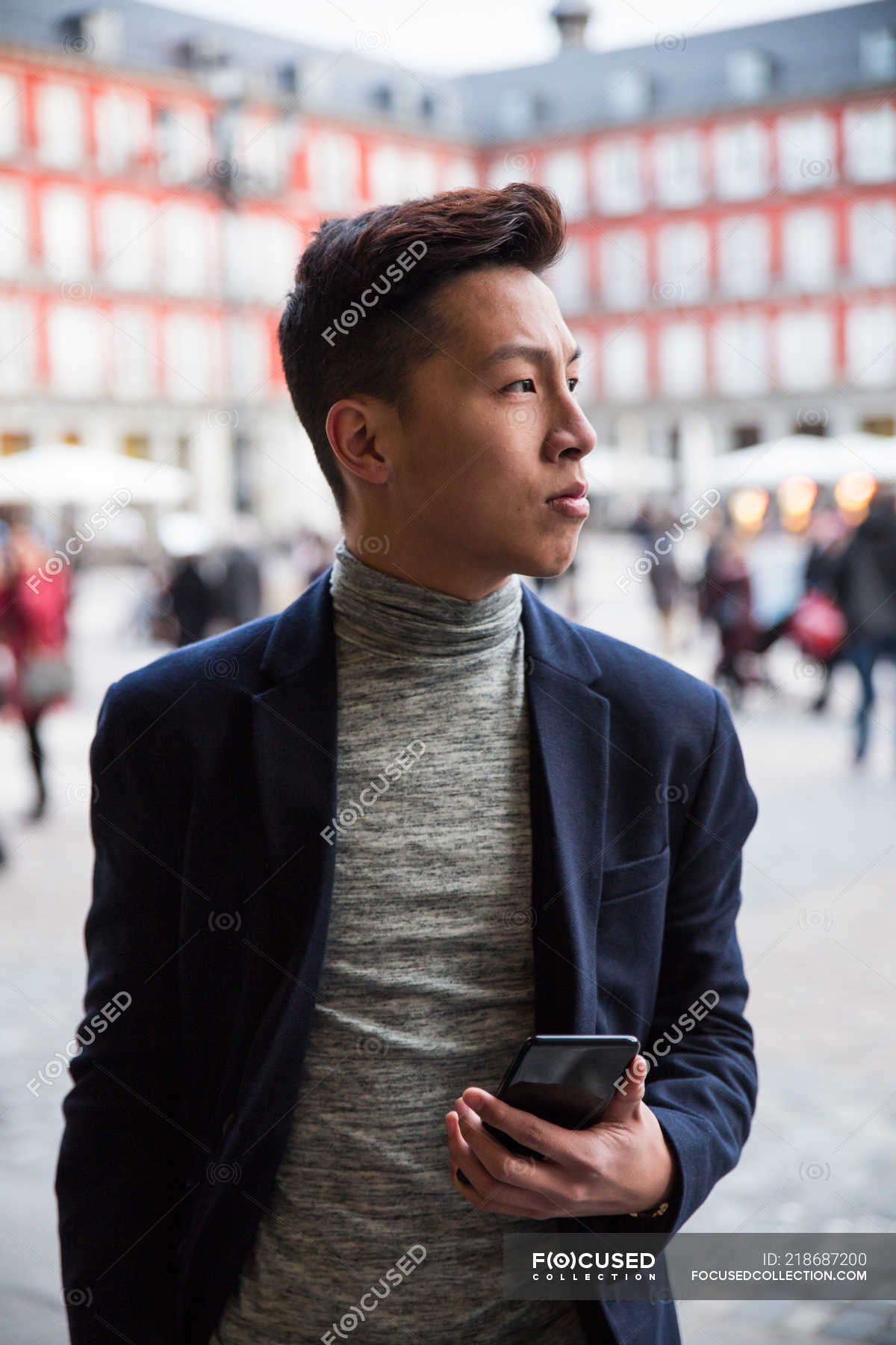 Casual Young Chinese Man At Plaza Mayor In Madrid Spain Smart Downtown Stock Photo