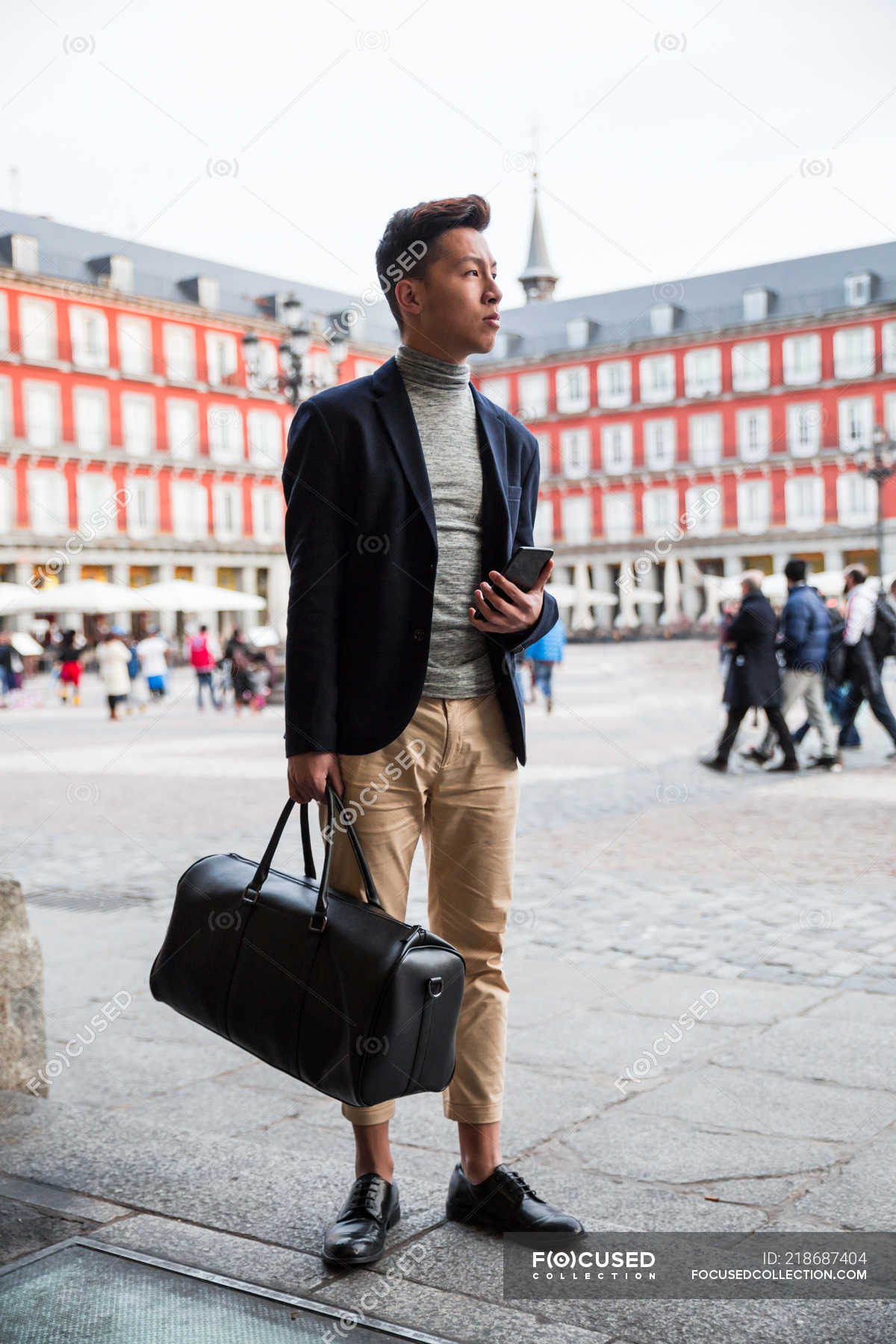 Casual Young Chinese Man At Plaza Mayor In Madrid Spain Freelancer Male Stock Photo