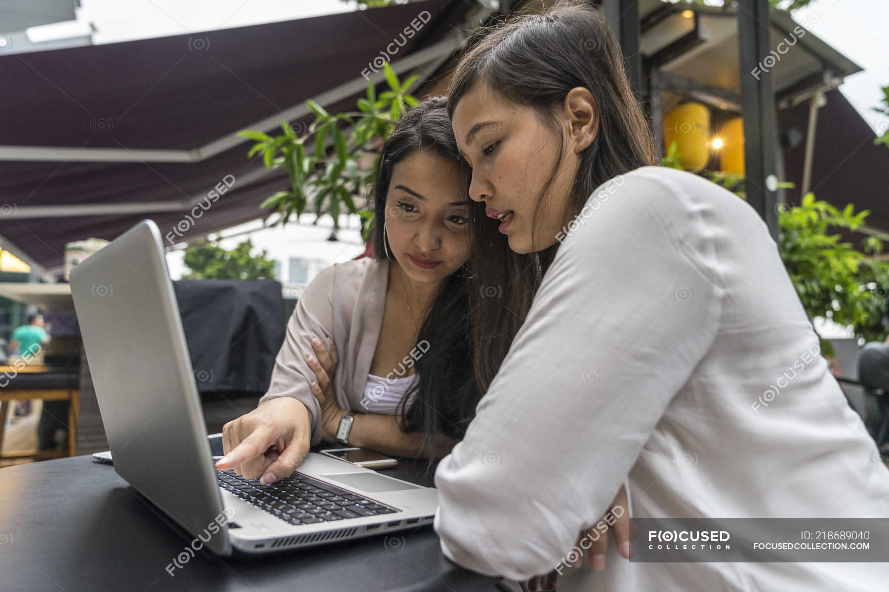 Two Malay Women Discussing About Work. — young adult, daylight Stock