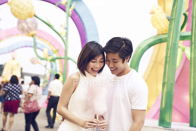 Young asian couple having fun at Chinese New Year festival — Stock Photo