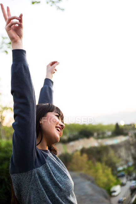 Eurasian woman showing peace gesture in Barcelona — Stock Photo