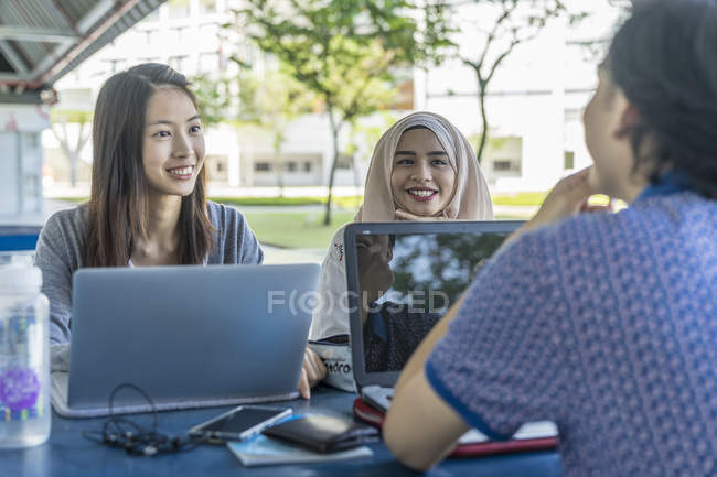 Group Of Friends Discussing Over School Project. — Stock Photo