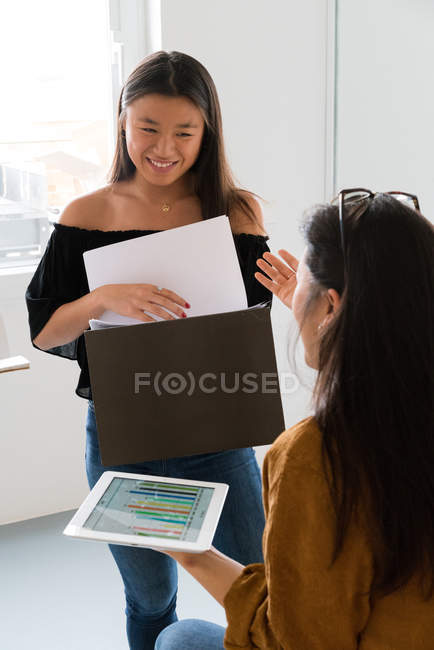 Young Chinese women having a discussion at home — Stock Photo