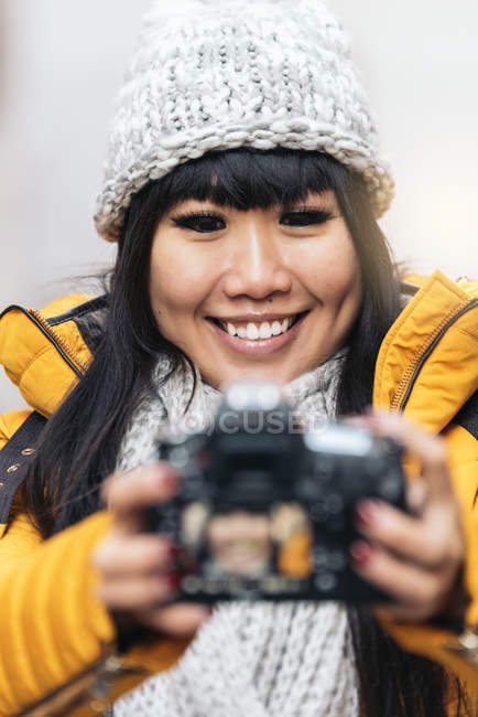 Tourist asian woman using camera in european street. Tourism Concept. — Stock Photo