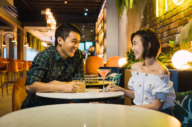 Young asian couple having date in comfortable bar — half body, guy - Stock  Photo | #212692772