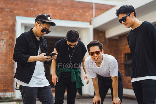 Portrait of cool young asian rock band — Stock Photo
