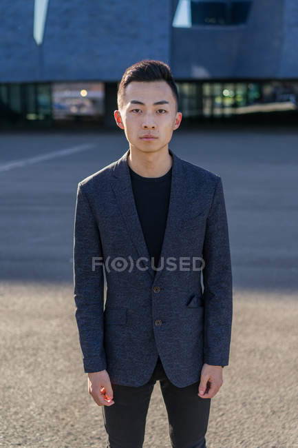 Portrait of young asian man in suit — Stock Photo