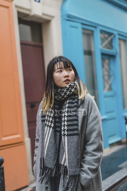 Young attractive casual asian woman on street — Stock Photo
