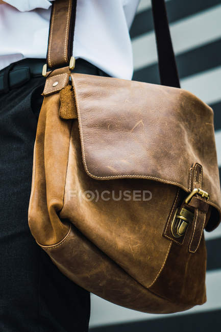 Closeup view of bag of successful young businessman — Stock Photo