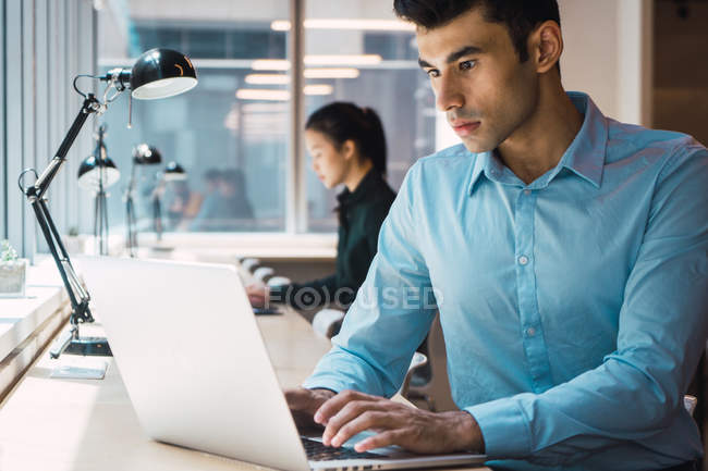Young adult business people working at modern office — Stock Photo