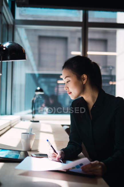 Young adult business woman working at modern office — Stock Photo