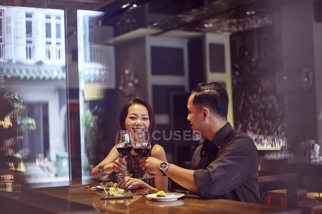 Young asian couple spending time at restaurant — Stock Photo
