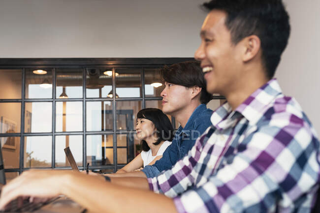 Asian team in a discussion — Stock Photo