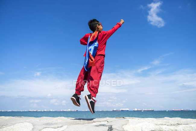 Superhero kid flying off. — Stock Photo