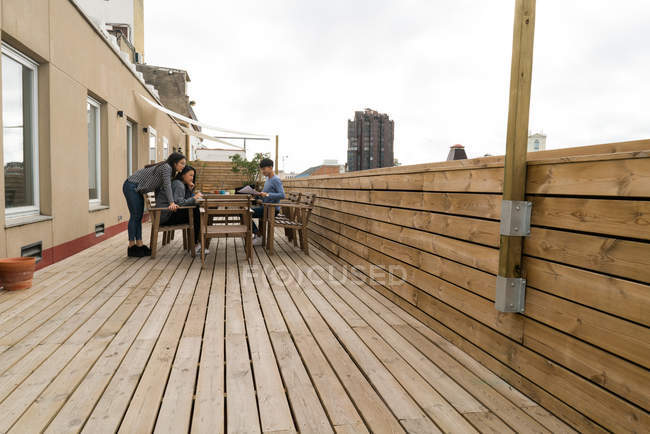 Chinese Entrepreneurs working from home at balcony — Stock Photo