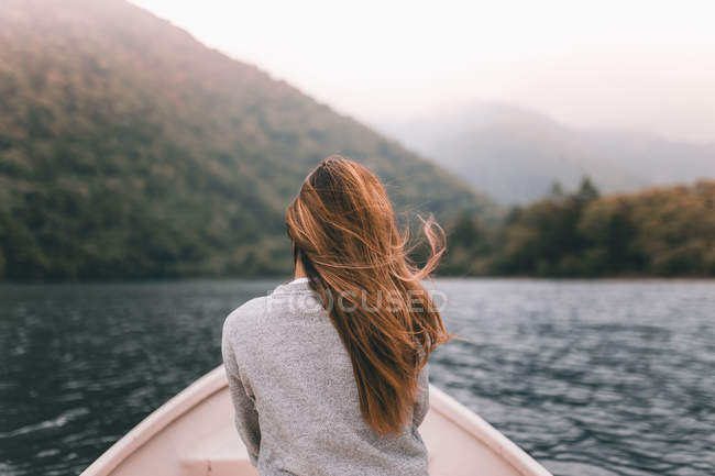 Back view of a young woman on a boat in Tokyo — Stock Photo