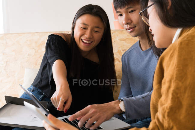 Women pointing out to a screen of laptop at home — Stock Photo