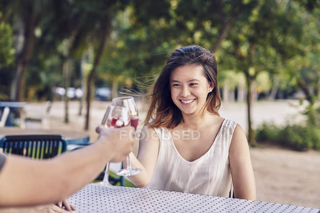 Young asian couple having date in cafe with drink — Stock Photo