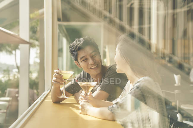 Young asian couple having date in cafe — Stock Photo