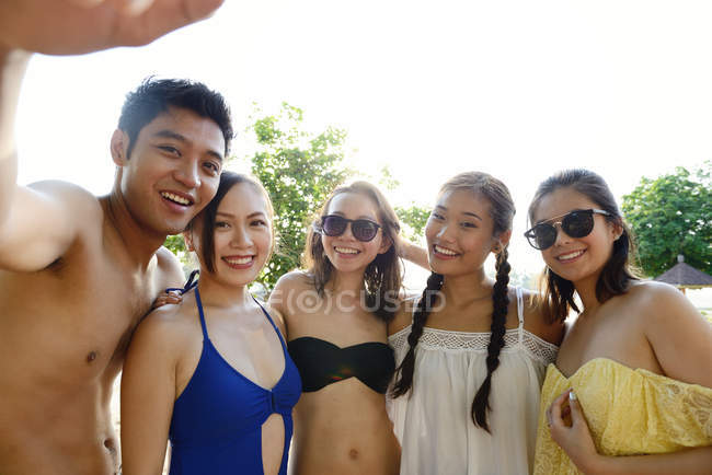 Young attractive asian friends taking selfie — Stock Photo