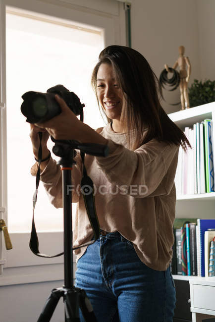 Long Haired Chinese young photographer — Stock Photo