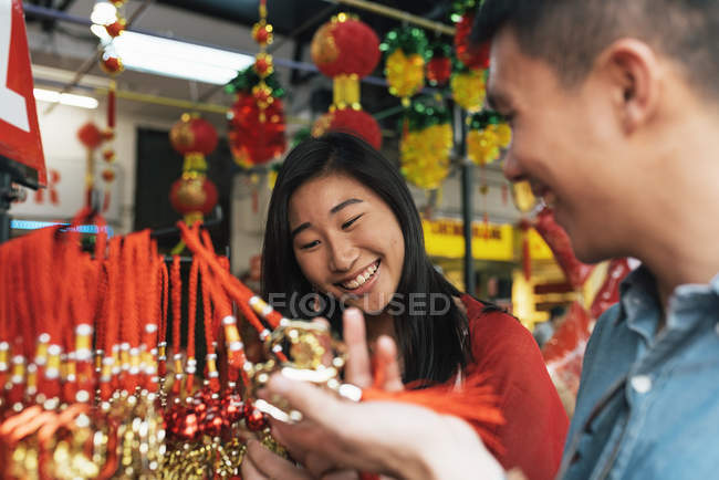 Young happy asian couple in Chinatown — Stock Photo