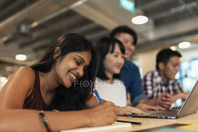 Young successful business people working together in modern office — Stock Photo