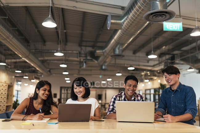 Asian colleagues at work space — Stock Photo