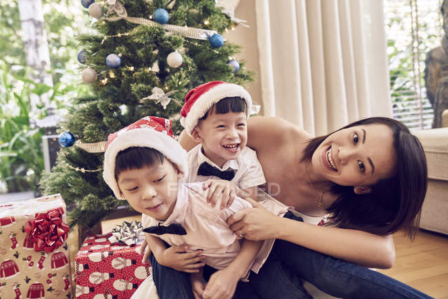 Happy asian family celebrating christmas together — Stock Photo
