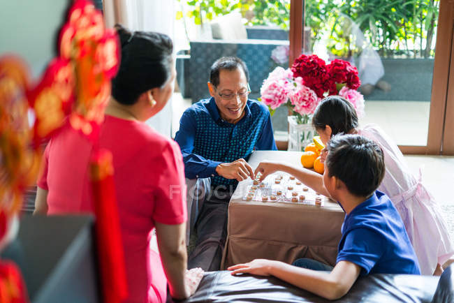 Happy asian family together playing game — Stock Photo