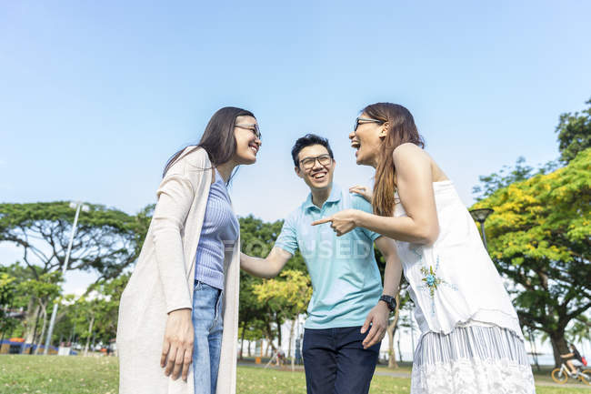 Group of young asian friends having fun outdoors — Stock Photo