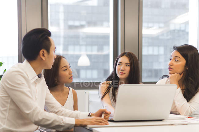 Young asian coworkers working in modern office — Stock Photo