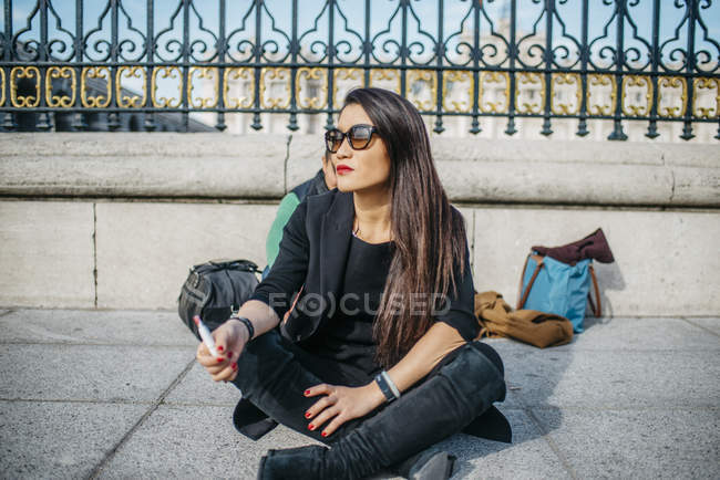 Chinese woman in Madrid vaping, Spain — Stock Photo